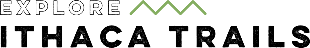 Logo for “Explore Ithaca” with black text and a green mountain-shaped line above the word “Explore.”